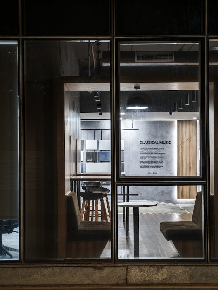 A stylish indoor space in India emphasizing classical music decor through large windows.